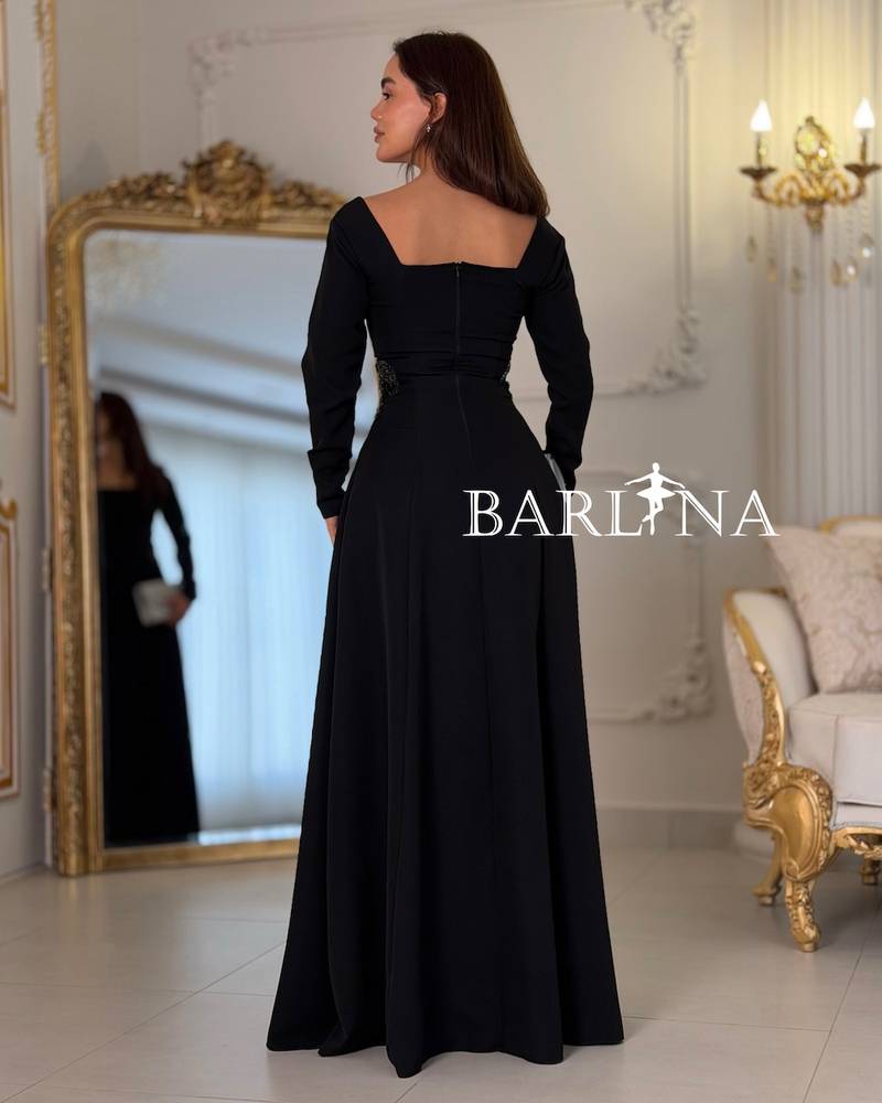 Long black dress with embroidery on the sides