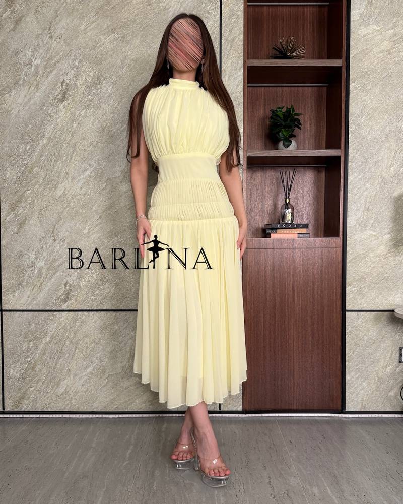 Pastel yellow dress with tie at the back