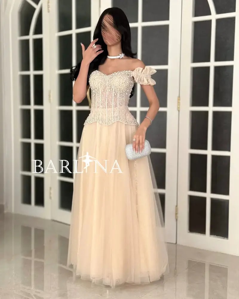 Beige evening dress with a corset cut and beaded embellishments
