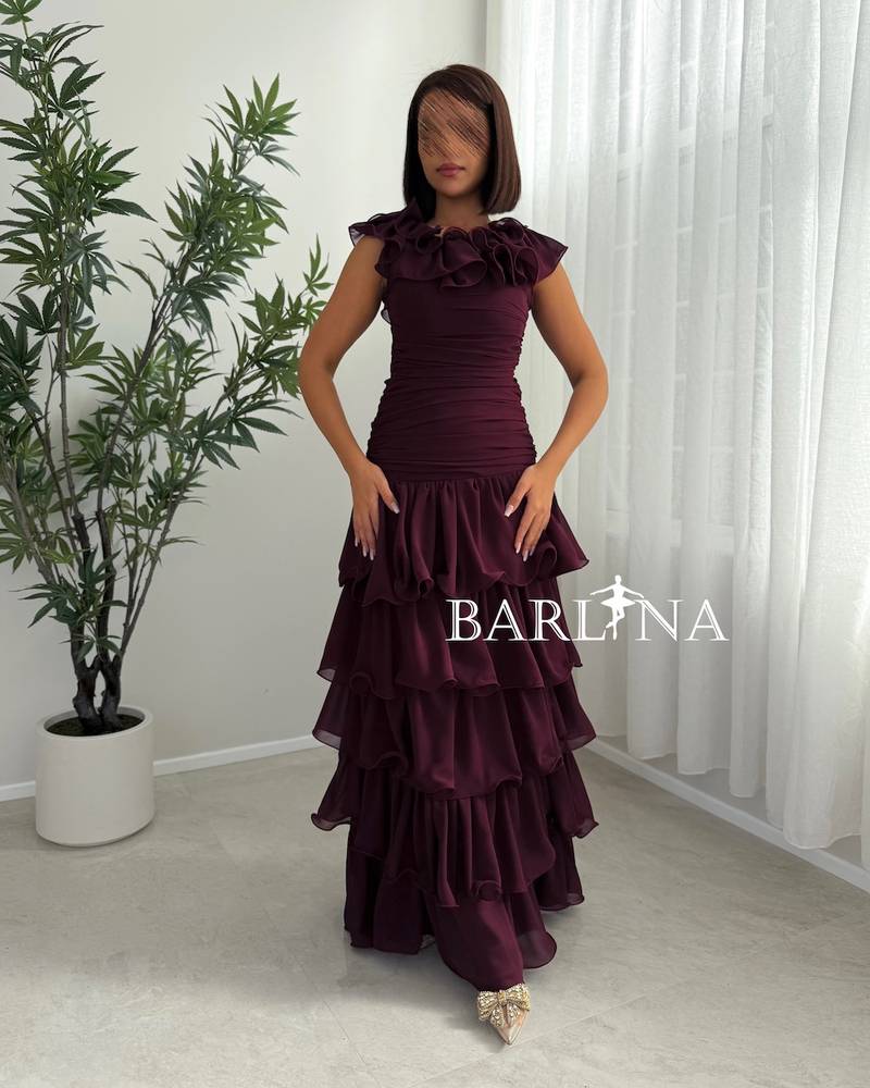 Burgundy dress with a ruffled collar and tiered layers