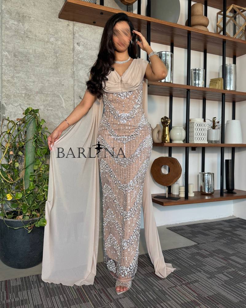Beige dress with shimmering embroidery and a long shawl