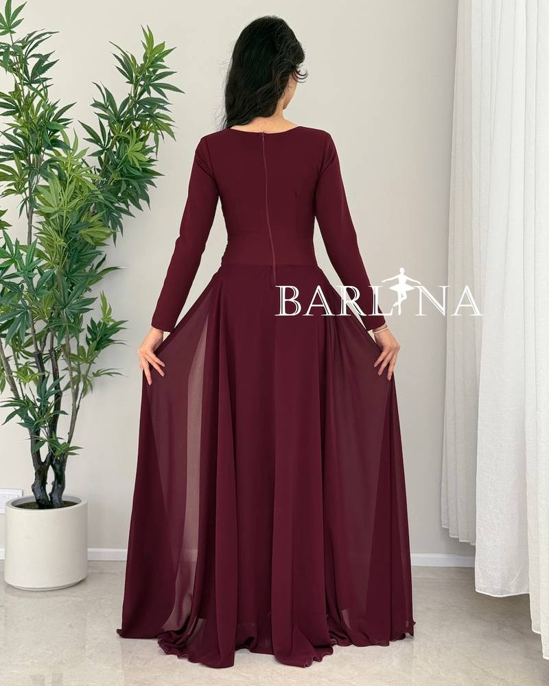 Dark burgundy dress with a gathered hem and a light train
