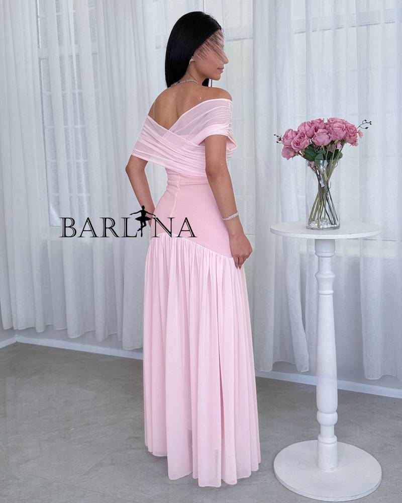 pink dress with a wrap-style off-shoulder cut