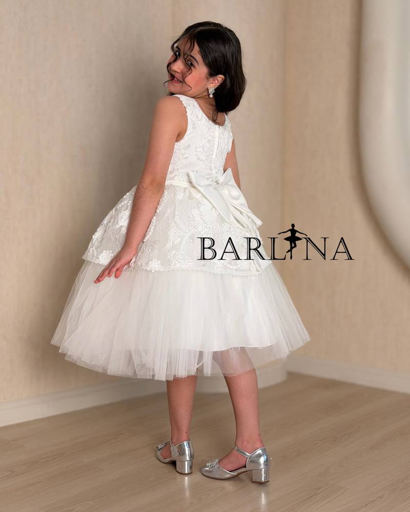 White girl's dress with prominent lace details