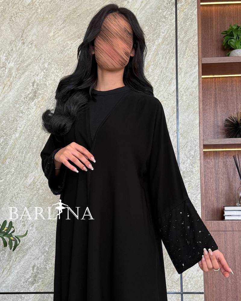 Black abaya with sleeves decorated with crystal accents