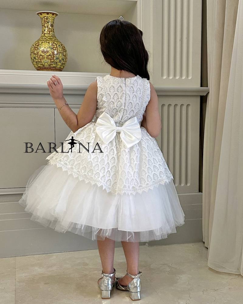 Girls white dress with lace patterns