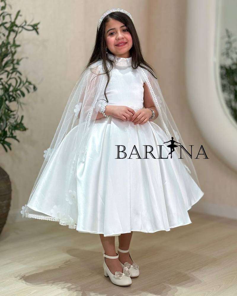 White girl's dress with cape sleeves and embroidered roses