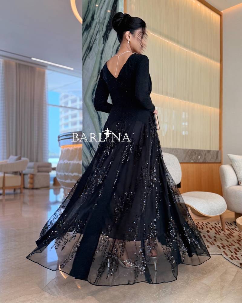 Black dress with a tulle layer decorated with sequins