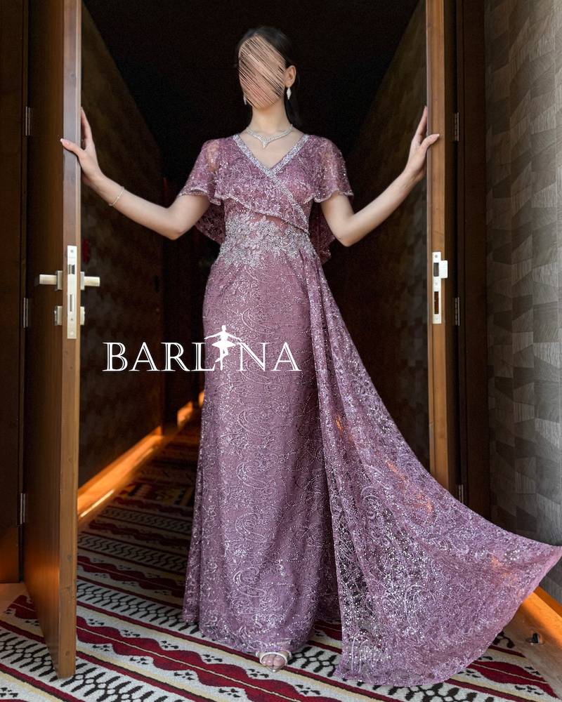 Pink dress with delicate embroidery and a side train
