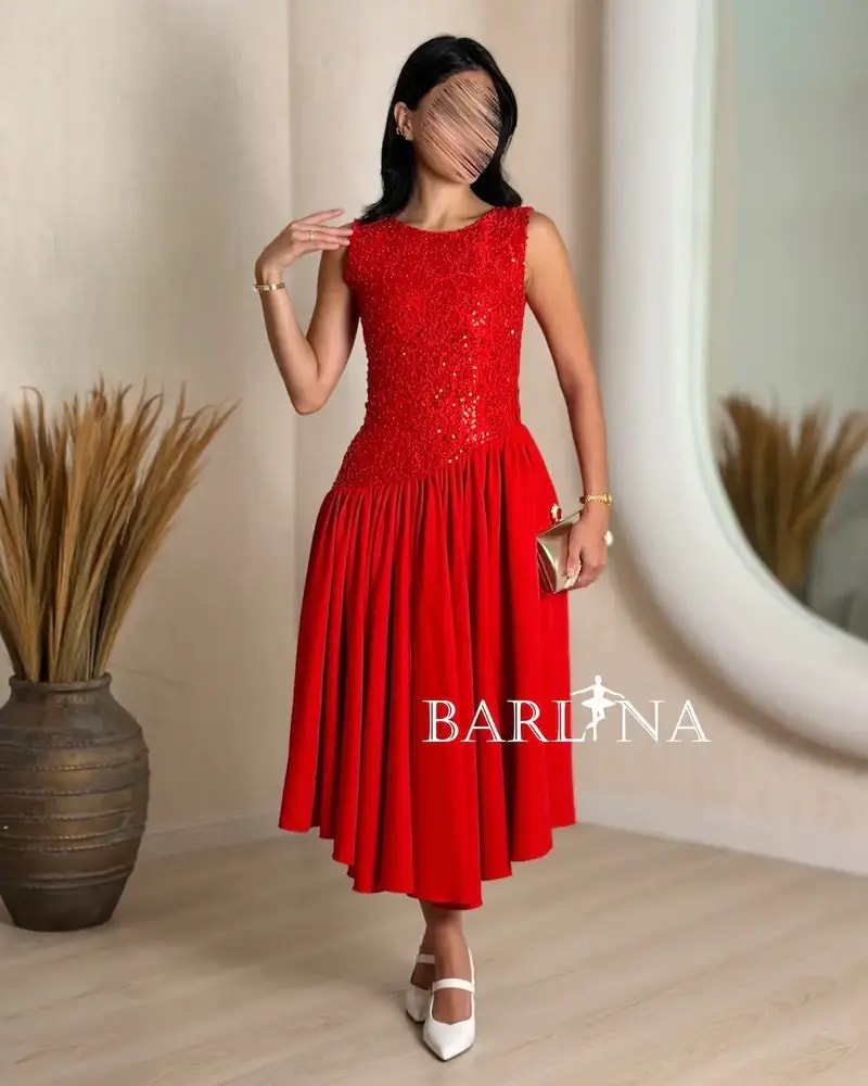 Soft midi dress with a sequined bodice