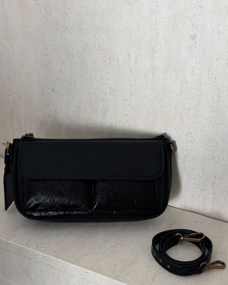 A soft handbag with a practical design and front pockets.