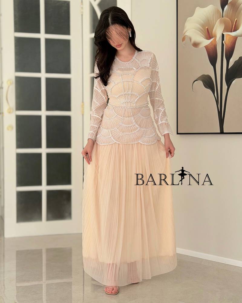 Beige dress with geometric white bead embroidery