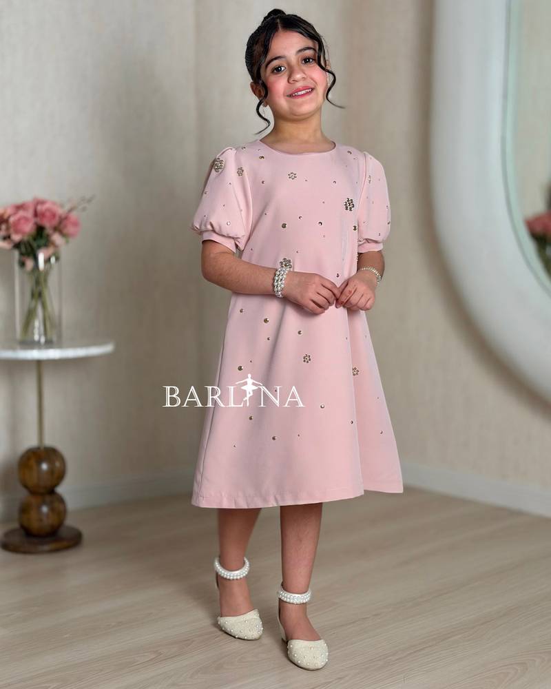 Pink girls' dress with a simple and elegant design
