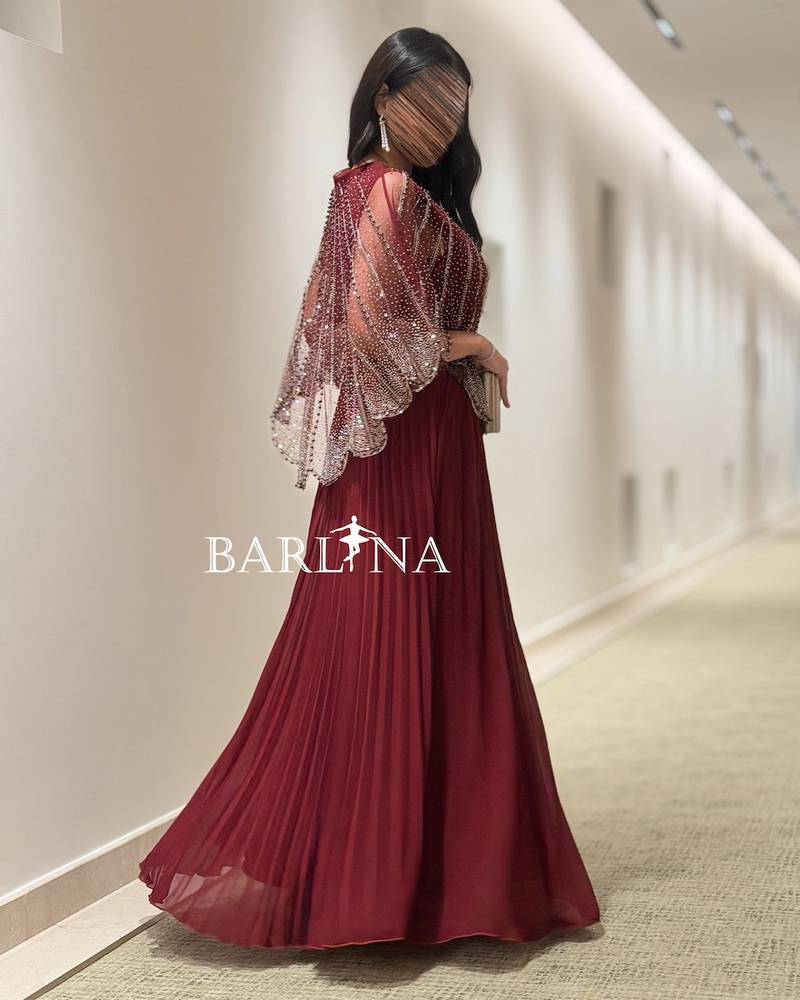 Loose burgundy dress with a beaded layer