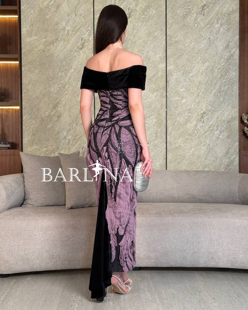 Black dress with prominent mauve embroidery