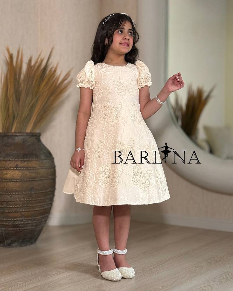 Beige girls' dress with butterfly print fabric