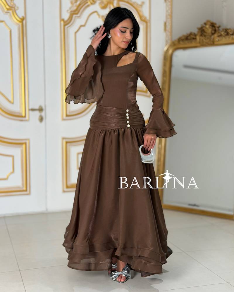Brown dress with sheer fabric and light layers