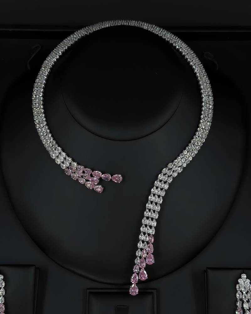 Modern accessory set with an open purple necklace