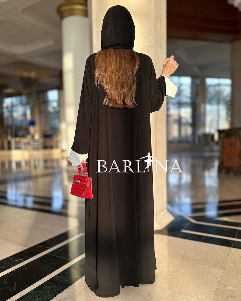 Black abaya with prominent white details