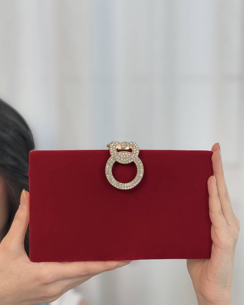 Velvet clutch bag with a gold frame