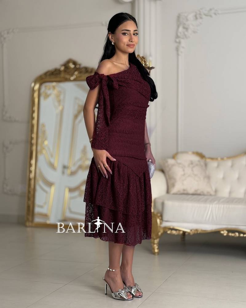 A dark burgundy dress made of fine lace