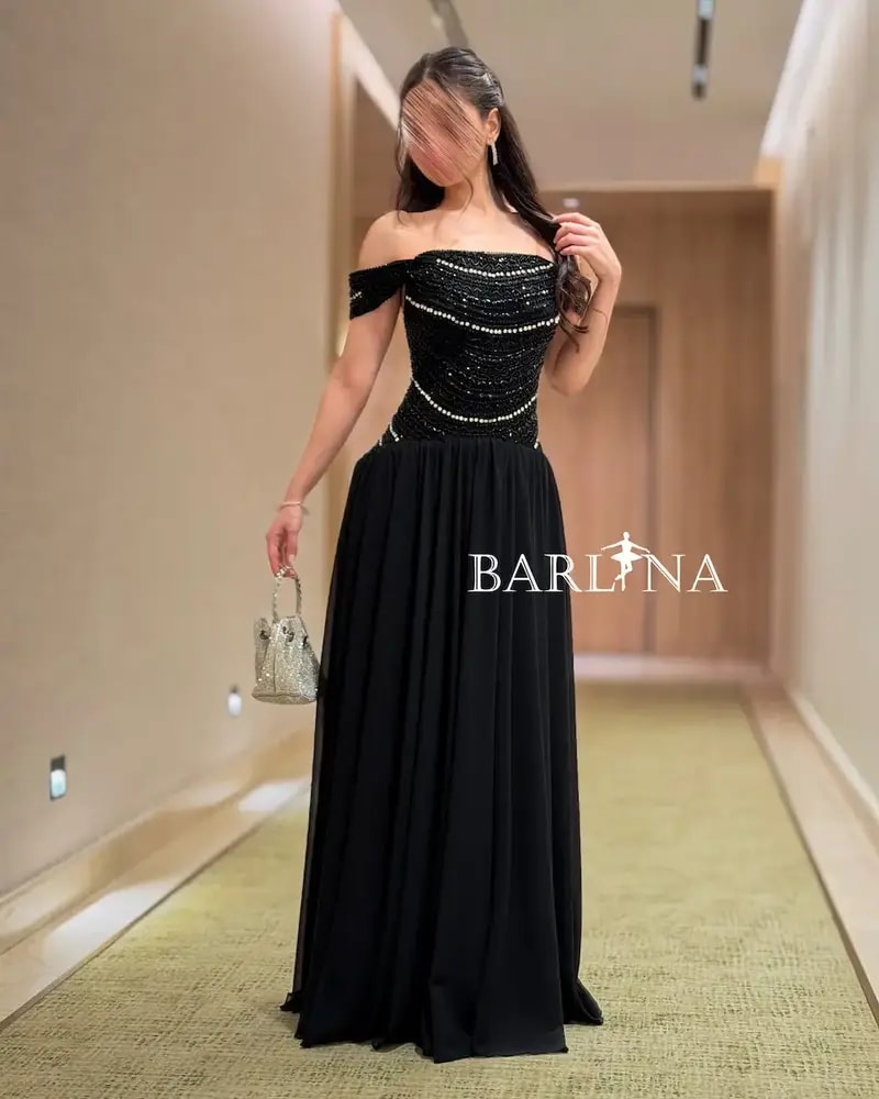 Elegant black evening dress adorned with sparkling stripes
