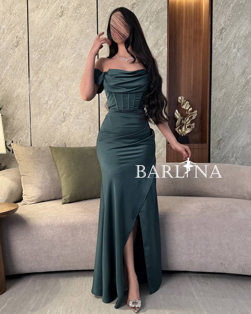 Green evening dress with corset design and front slit