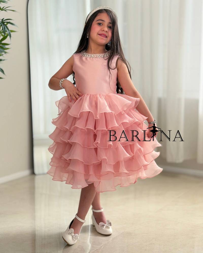 Pink layered girls' dress with a puffy cut