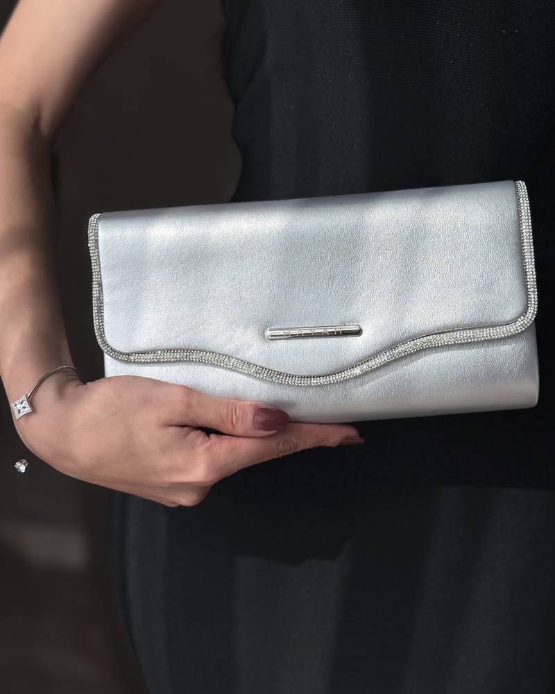 Clutch bag decorated with crystal trim