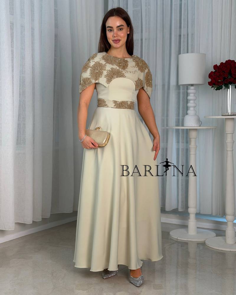 Soft beige dress with a layer embroidered with gold embroidery