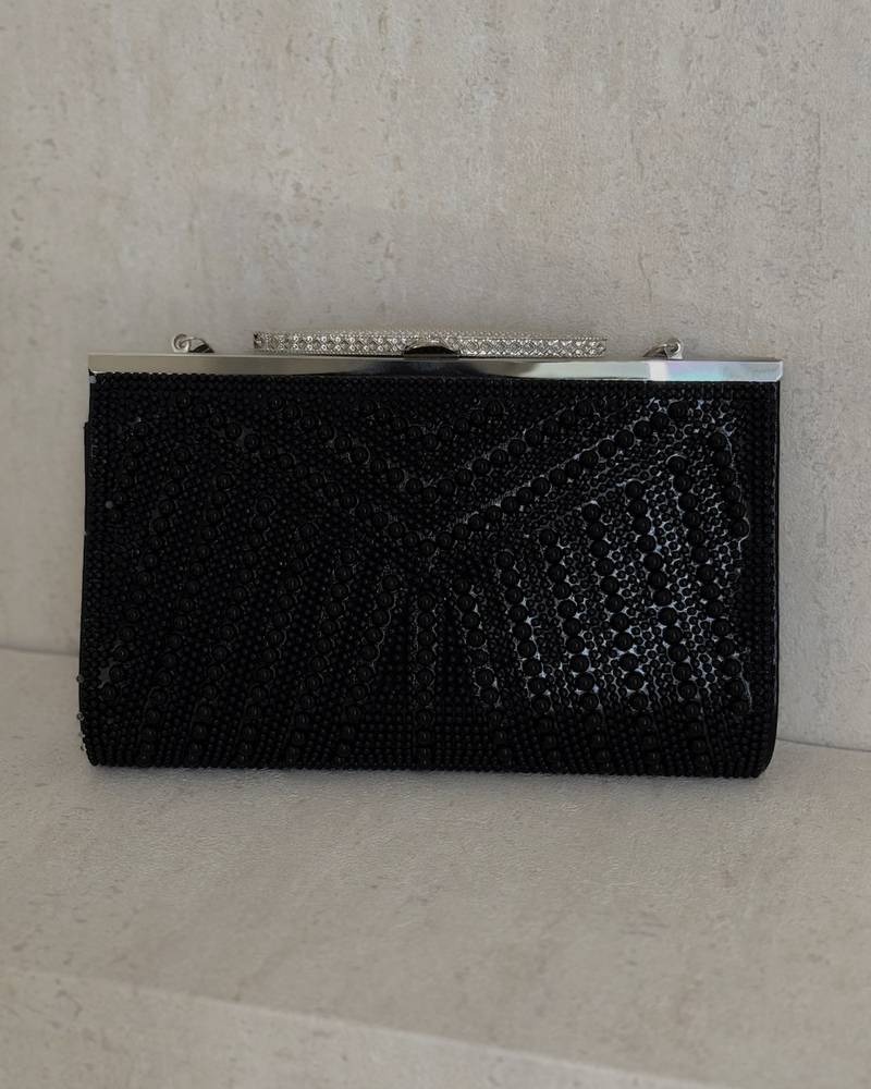 Pearl evening clutch bag with a geometric design