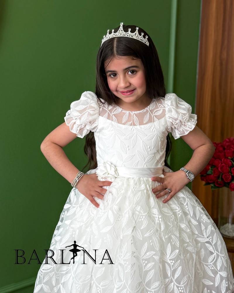 White fluffy girl's dress with delicate embroidery