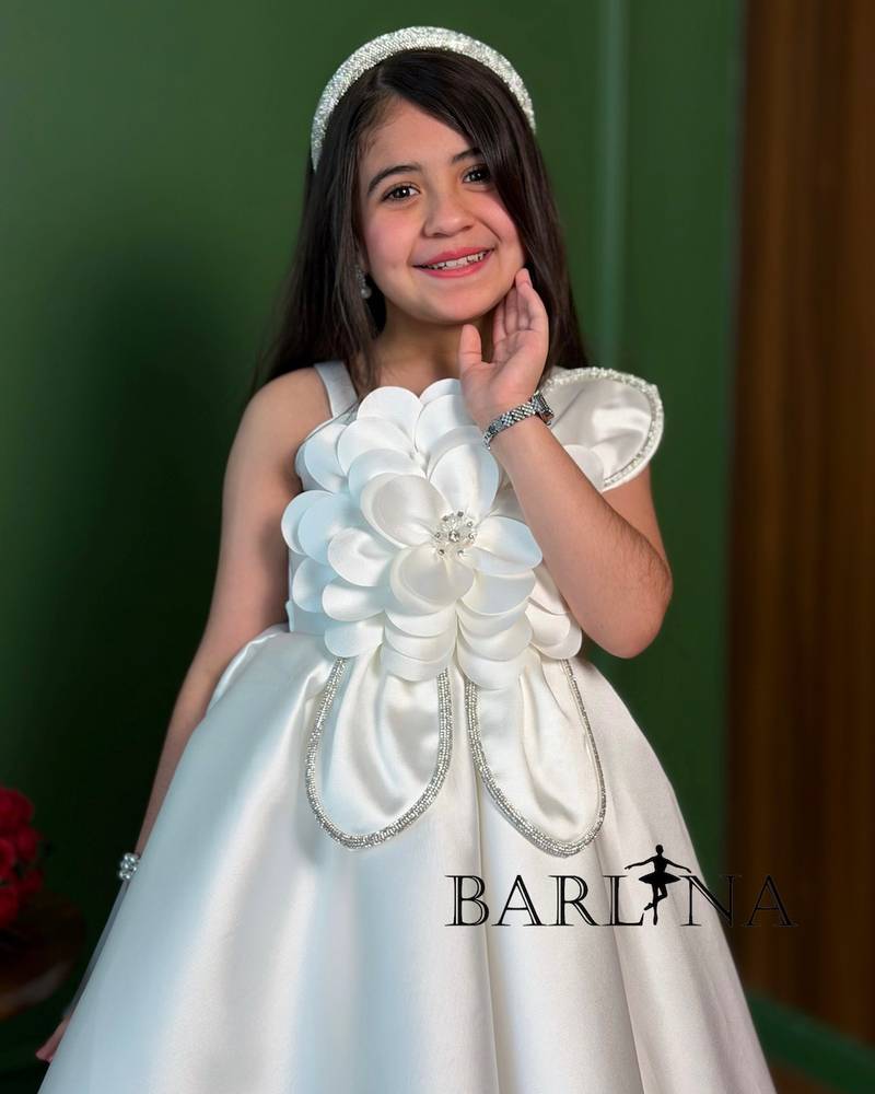 white puffy girl's dress with a rose detail