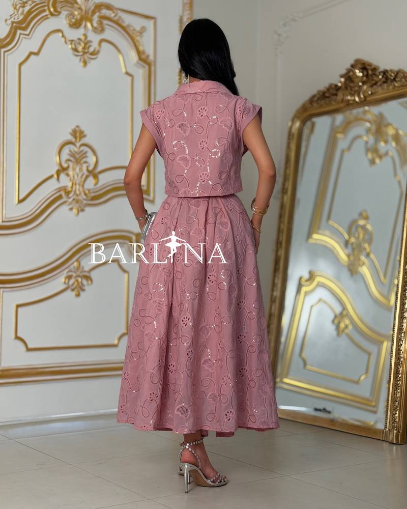 A soft set with a short blouse and crystal buttons