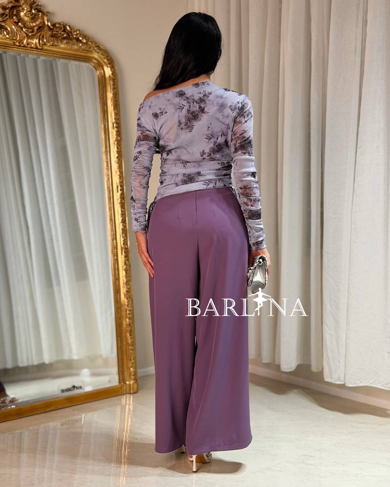 Set with purple pants and a gray floral top