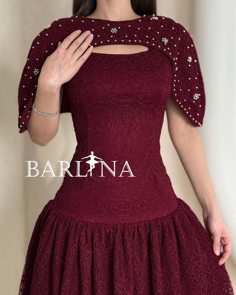 Burgundy lace dress with a feminine cut