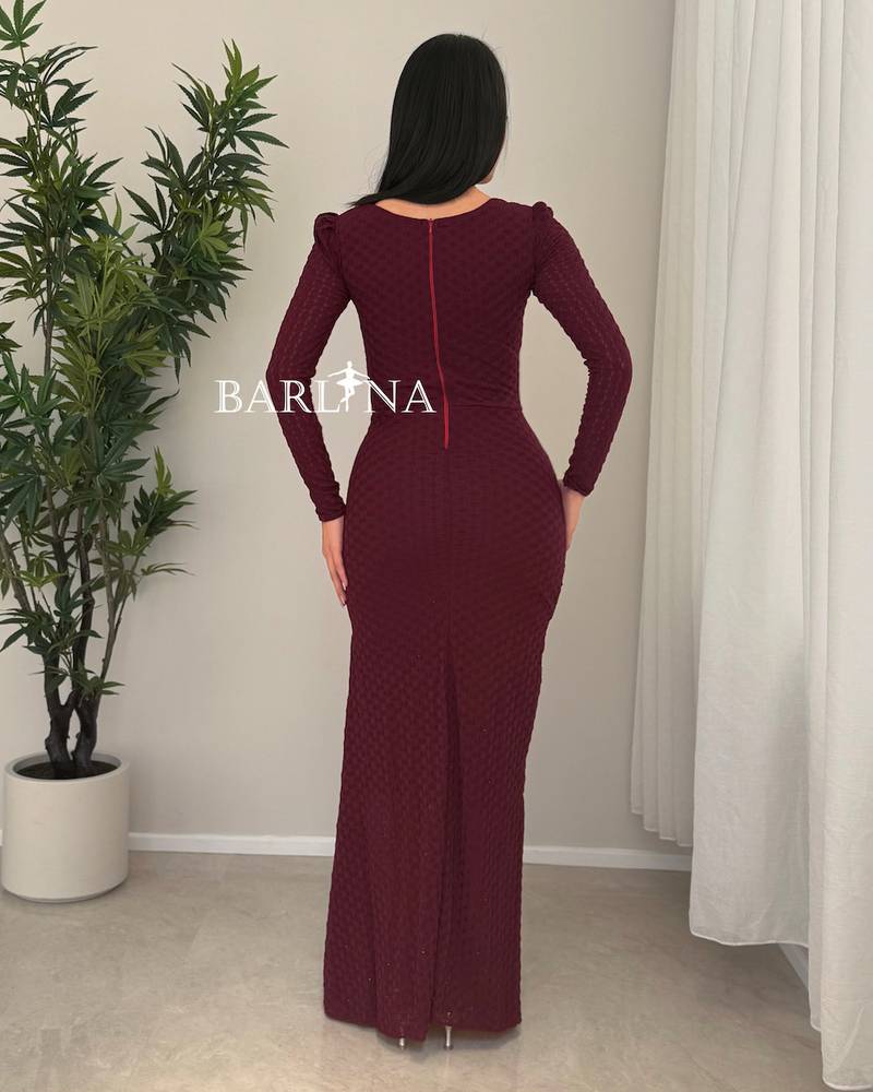 A soft burgundy dress with elegant details