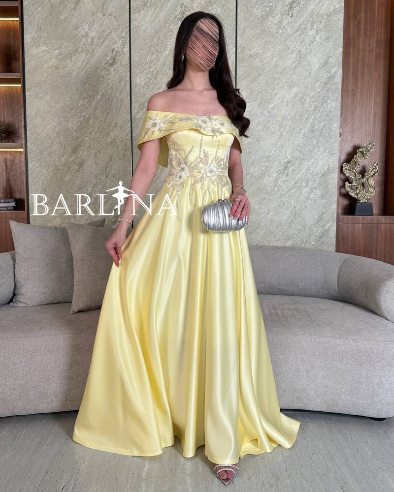 Yellow off-shoulder dress with delicate embroidery