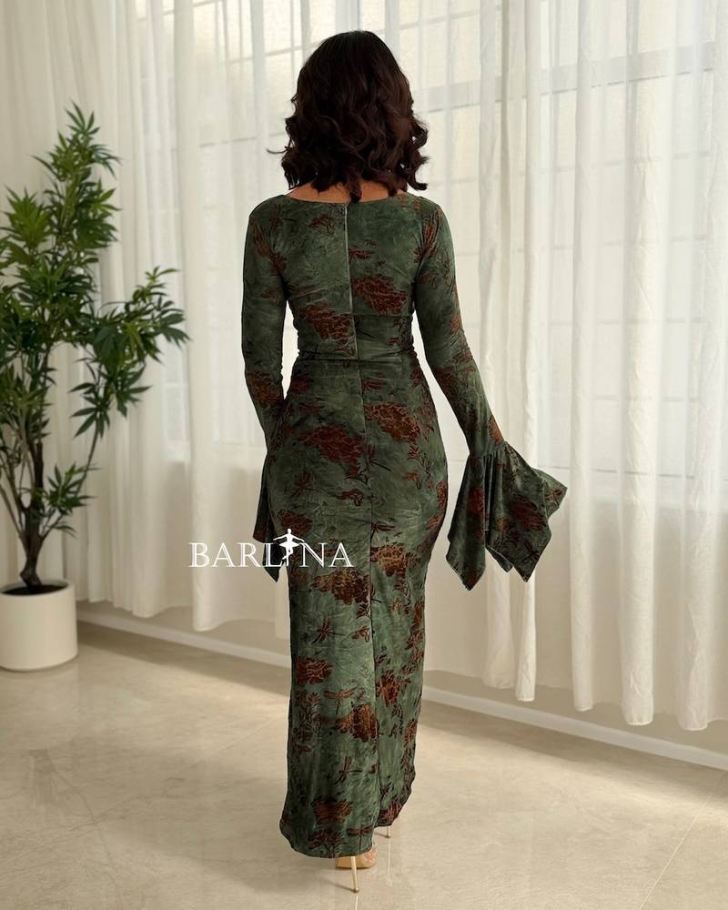Green dress with patterned fabric and a front slit