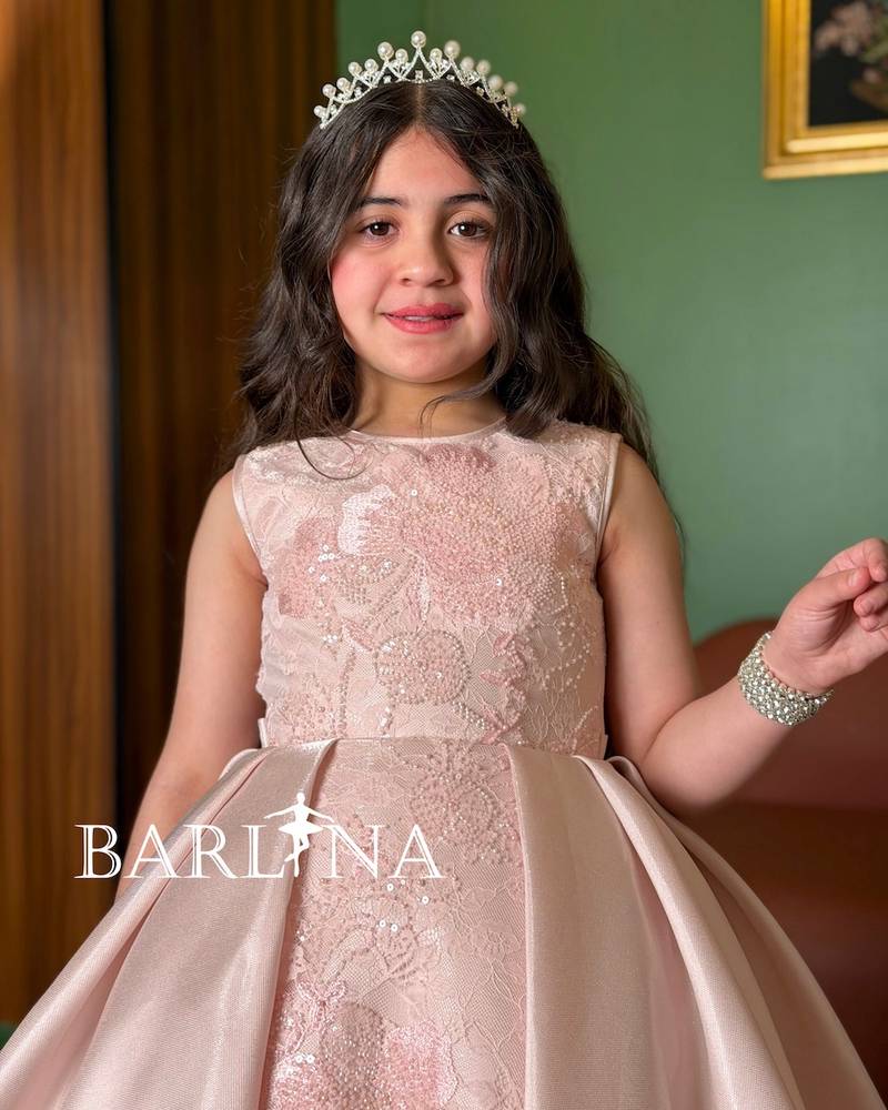 Pink girls' evening dress with a high-low cut