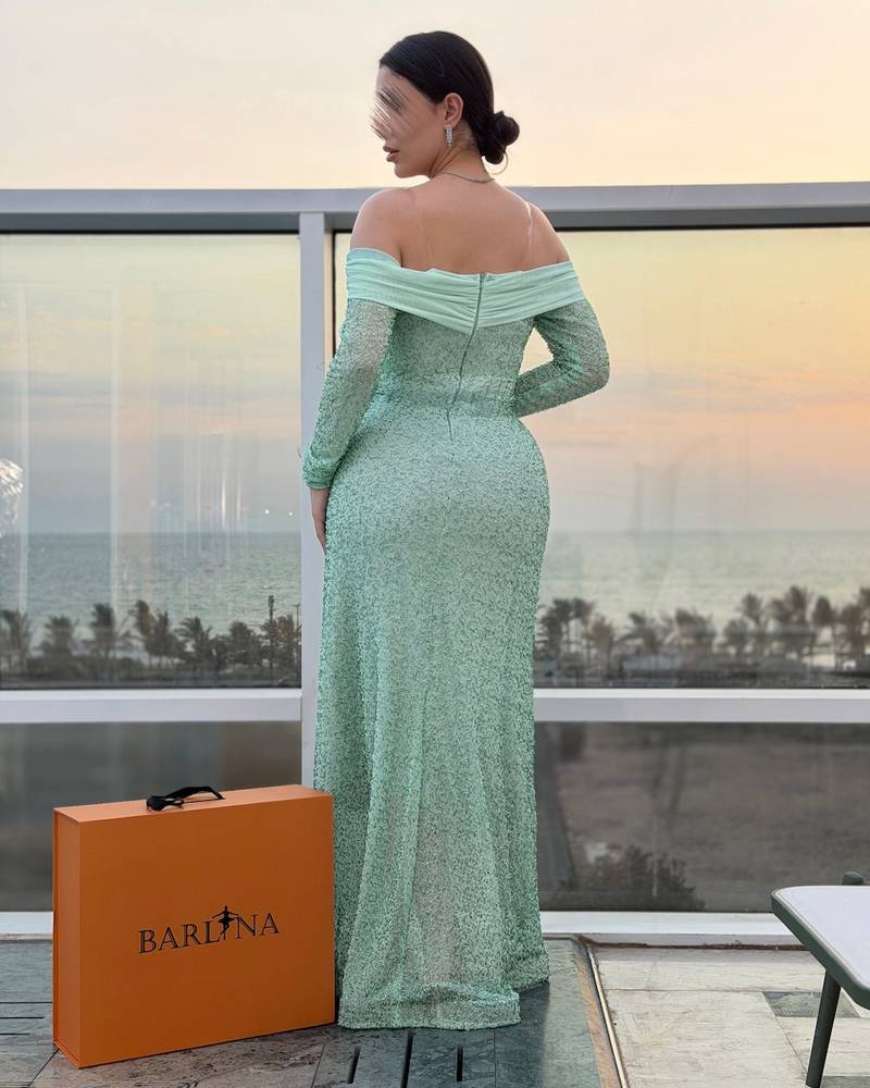 Off-shoulder evening dress with full beadwork
