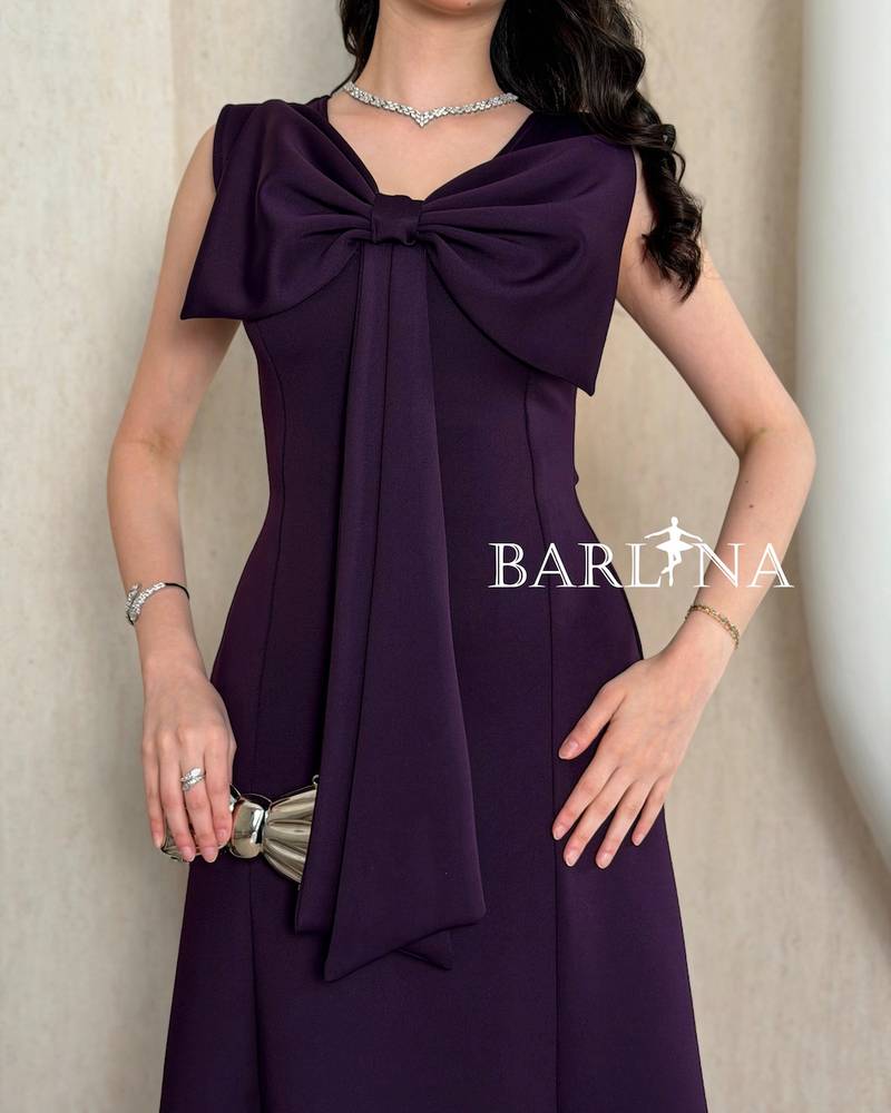 Dark purple midi dress with a large bow