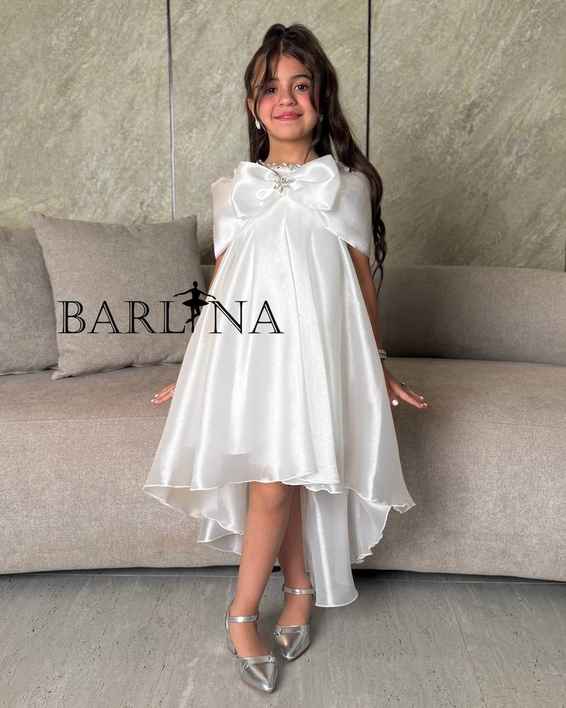 Girls' white dress with a back train design