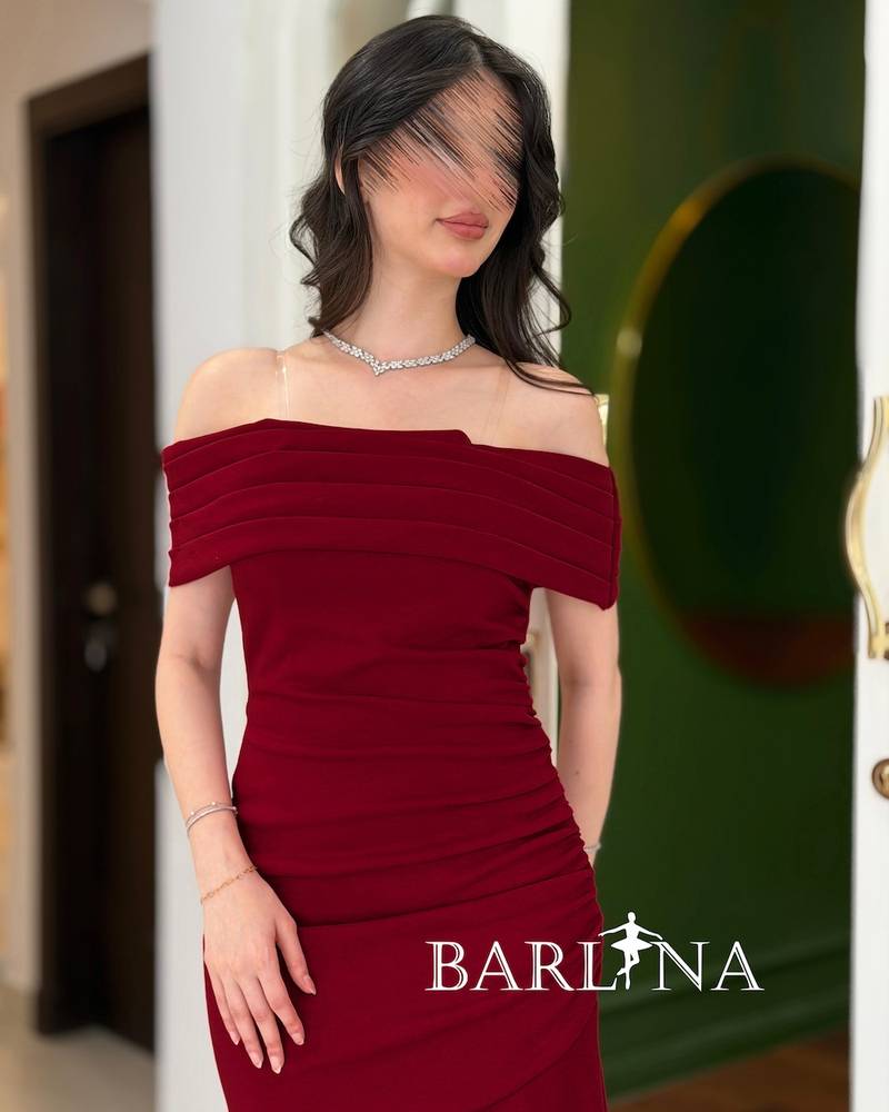 Red draped dress with dropped shoulders