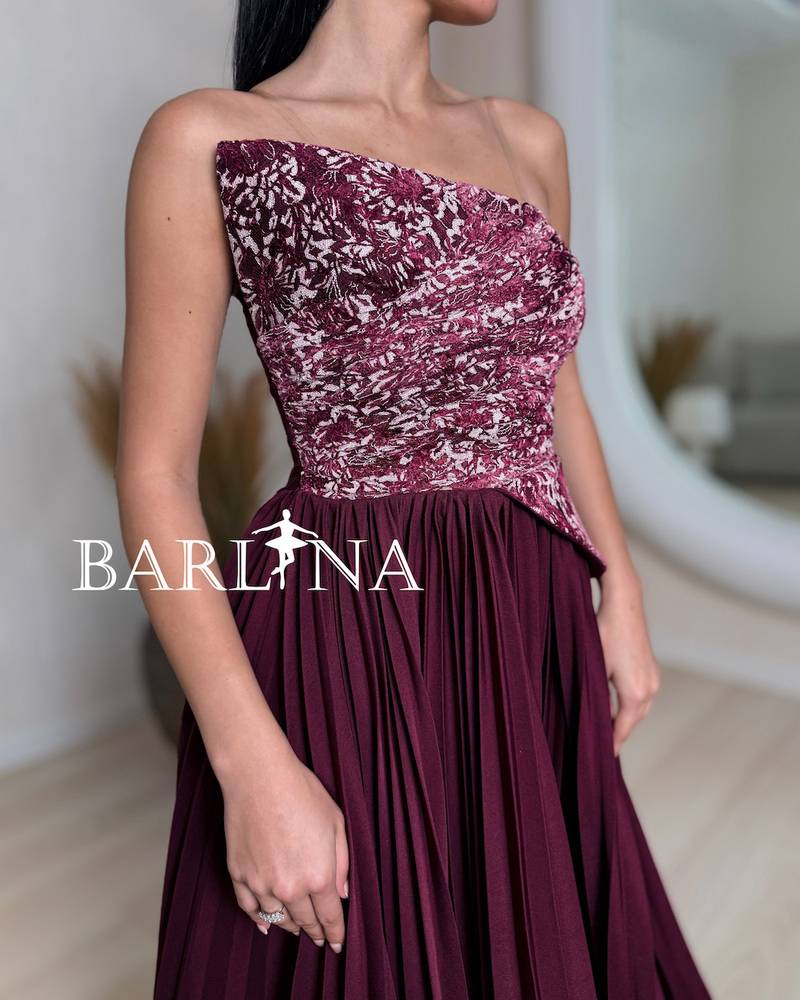 A soft burgundy dress with an elegant embroidered bodice