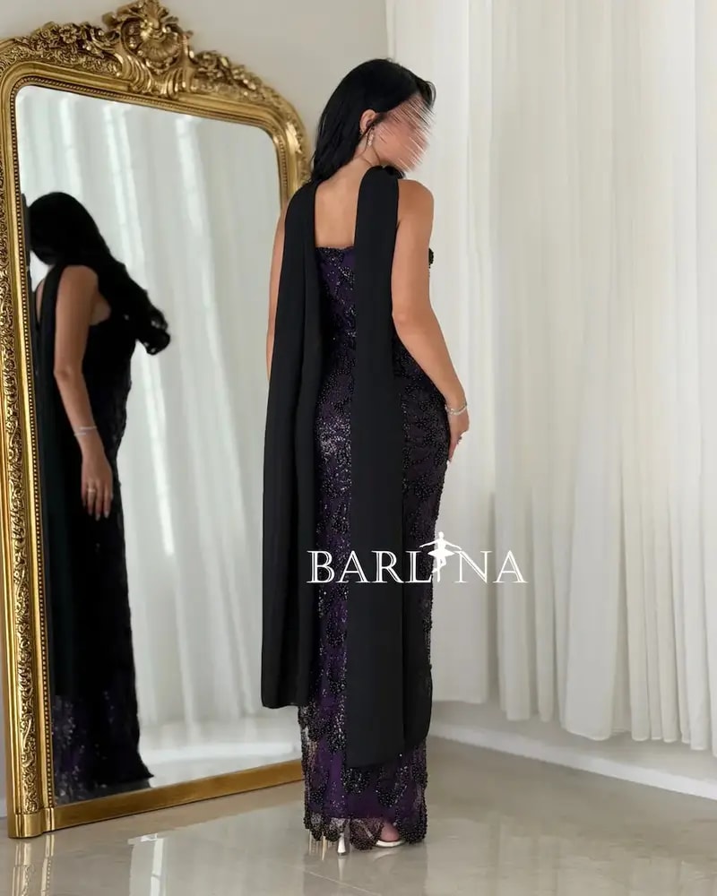 A purple embroidered dress with an elegant shawl