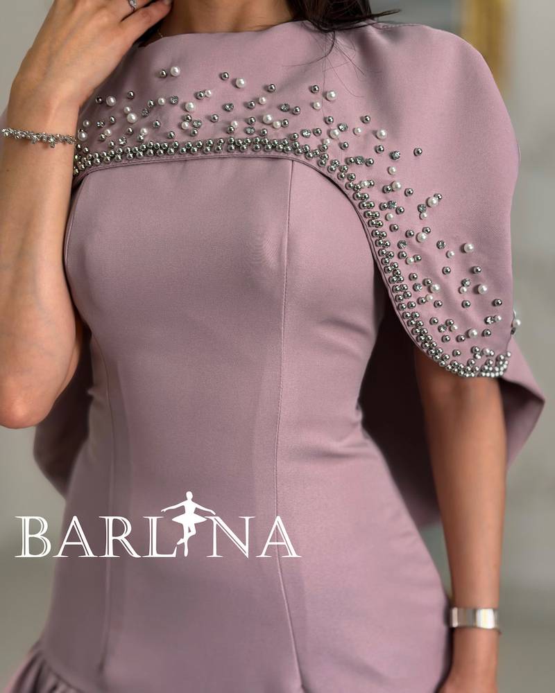 A short dress adorned with pearl details