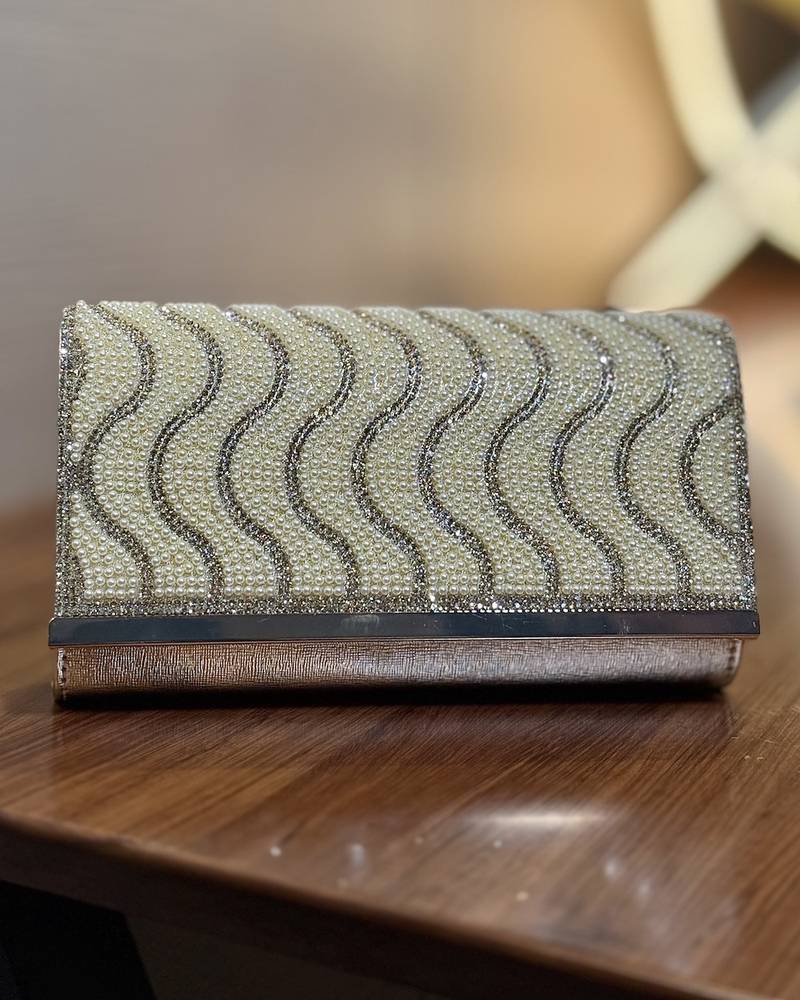 Evening bag designed with waves-shaped beads