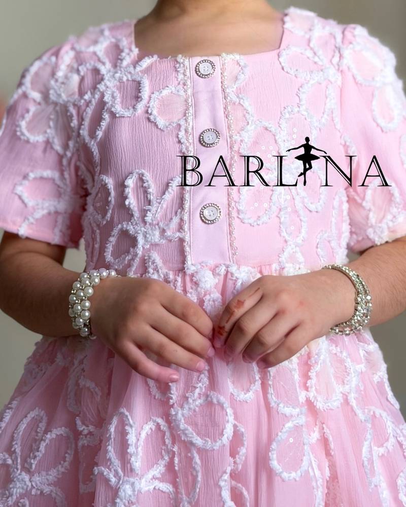 Pink girl's dress embroidered with white roses