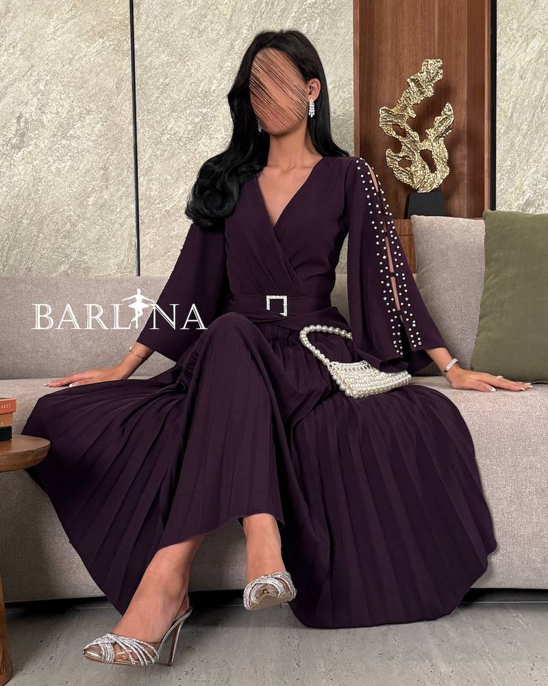 Dark purple dress with pearl embellished sleeves